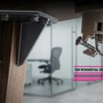 Office vs Home Furniture - Professional 16:9 hero banner. Ultra high resolution. A close-up, high-contrast shot of two distinct furniture joints: one visibly robust, reinforced, and commercial-grade, with a subtle glow of #737373 accentuating its strength and certifications. Beside it, a visibly weaker, domestic-grade joint, with elements of #E2087E and #000000 highlighting its fragility and lack of compliance. The background is a subtly blurred modern office or school interior, suggesting the intended environments. The image metaphorically represents the core difference in durability and safety standards. Style: Macro detail photography, authoritative lighting.