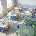 case study study and example - Professional 16:9 hero banner. Ultra high resolution. An aerial, slightly abstract view of a meticulously organised primary school classroom mid-renovation, with new, brightly coloured, ergonomic chairs and tables arranged in flexible learning zones. Sunlight streams through large windows, illuminating dust motes and highlighting the clean lines of the new furniture. The scene implies transformation and progress, with a subtle glow of #737373 accenting the edges of the furniture, hinting at the new life brought into the space. A hint of #E2087E can be seen in some of the furniture elements, contrasting with the neutral, clean classroom palette. Style: Editorial photography, clean and bright. Avoid: Groups of people, cluttered scenes, generic office environments.