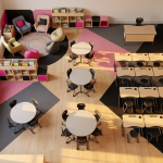 Primary School Classroom Layouts - Professional 16:9 hero banner. Ultra high resolution. An aerial view of a meticulously designed, bright primary school classroom, devoid of pupils, showcasing distinct learning zones. The layout is a harmonious blend of traditional rows, group pods, and a colourful, inviting reading corner with soft furnishings. Geometric patterns on the floor subtly delineate these areas, suggesting structure and purpose. Sunlight streams through large windows, highlighting the organised space. Key furniture pieces (desks, chairs, shelving) are visible, all ergonomically designed and child-sized. The entire scene is subtly bathed in an accent glow of #737373, with elements of #E2087E and #000000 providing complementary accents to the furniture and zoning. Style: Editorial photography, clean, architectural. Avoid: Groups around holographic tables, generic tech aesthetics, text overlays, cold blue tones, stock photo clichés.